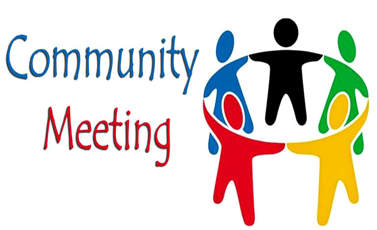 Community Meeting sign with colorful paper and happy participants